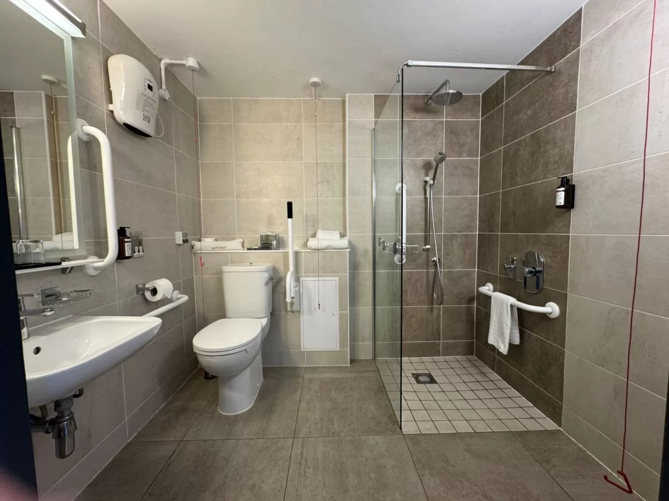Spacious bathroom in accessible room