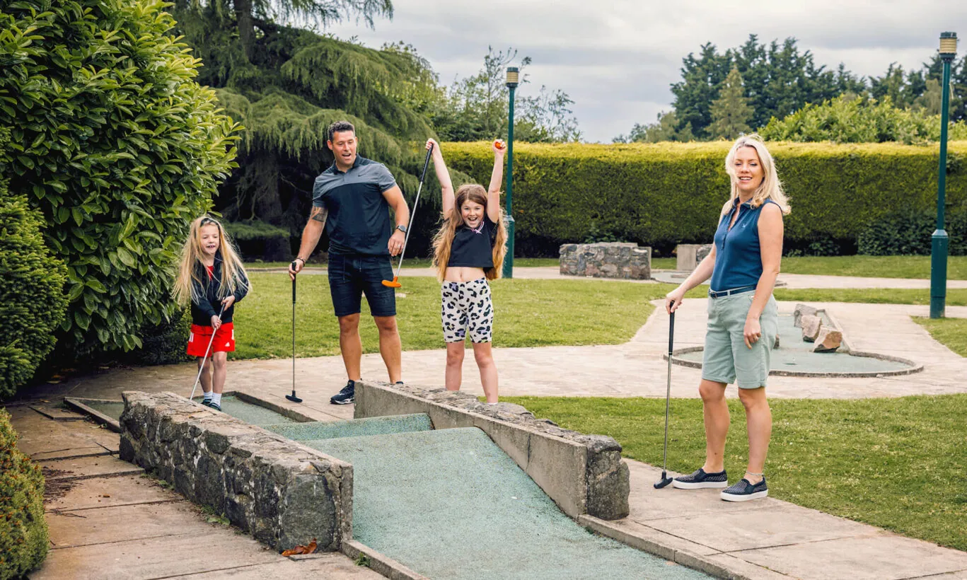 Family enjoying the crazy golf course