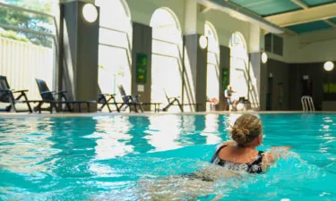 Woman swimming at the large swimming pool at Rutland Hall Hotel & Spa